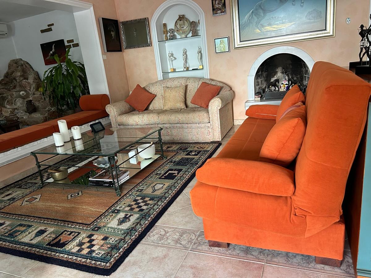 Custom design and installation of long fabric curtains for living room in Benalmádena